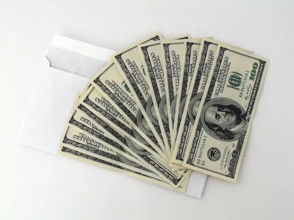 Cash in envelope symbolizing fines and financial penalties after DUI conviction in Florida.