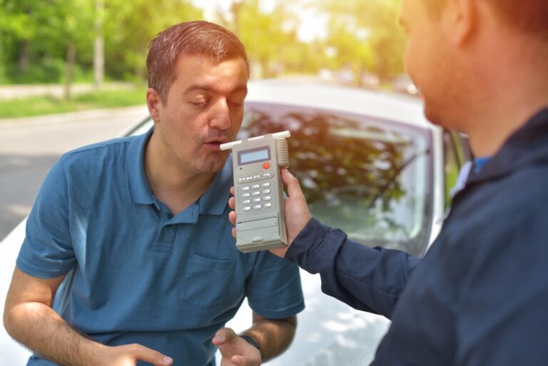 Driver taking roadside breathalyzer test showing procedures for breathalyzer results in Florida courts