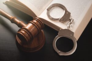 image of a gavel and handcuffs. concept of a criminal defense attorney in Melbourne, FL