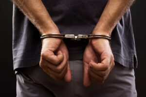 image of a man in handcuffs. concept of a criminal defense attorney in Melbourne, FL