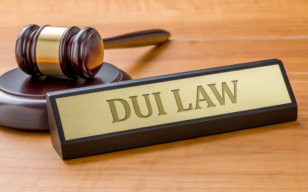 Image shows a courtroom gavel beside a DUI law nameplate, symbolizing how Florida courts evaluate prior impaired driving records.