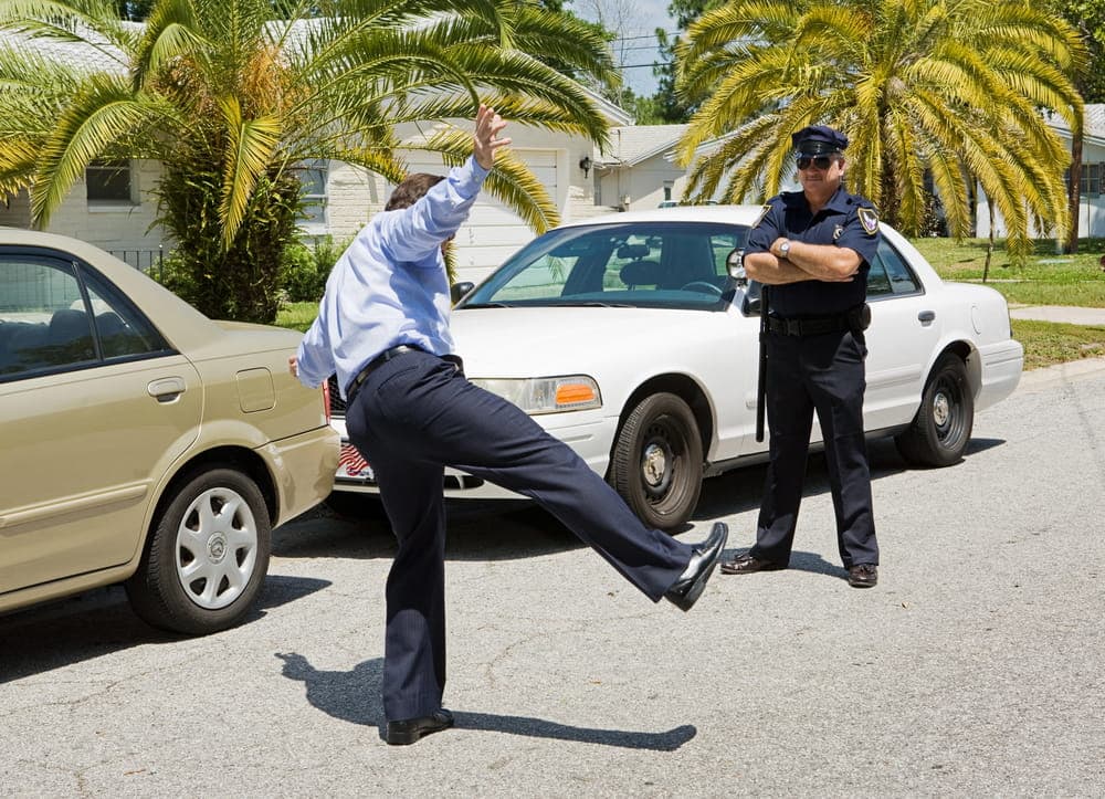 Image of a driver performing a field sobriety test on the road, showcasing the testing procedure used in Cocoa Beach DUI cases.