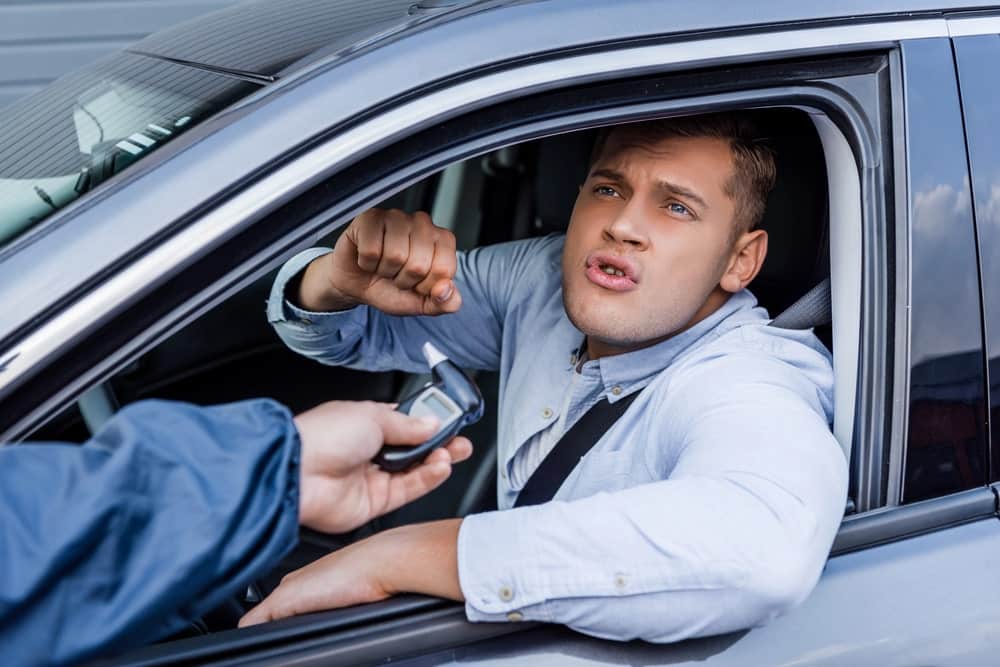 Image of a police officer speaking with a driver, with a field sobriety test in progress, demonstrating the procedure in Cocoa Beach DUI cases.