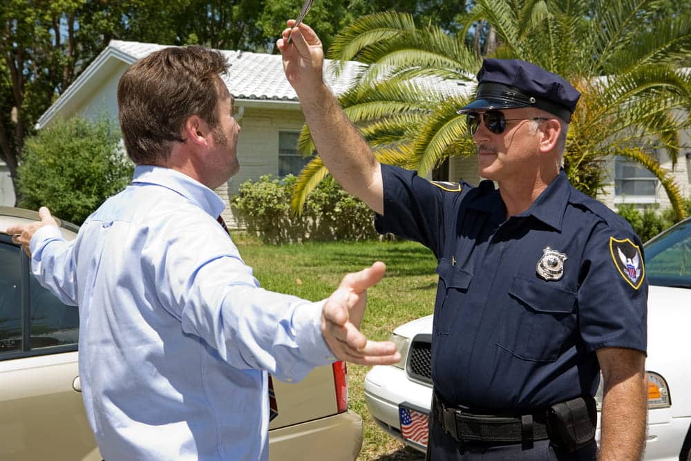 mage of a police officer administering a field sobriety test to a driver during a roadside stop, illustrating the process in Cocoa Beach DUI cases.