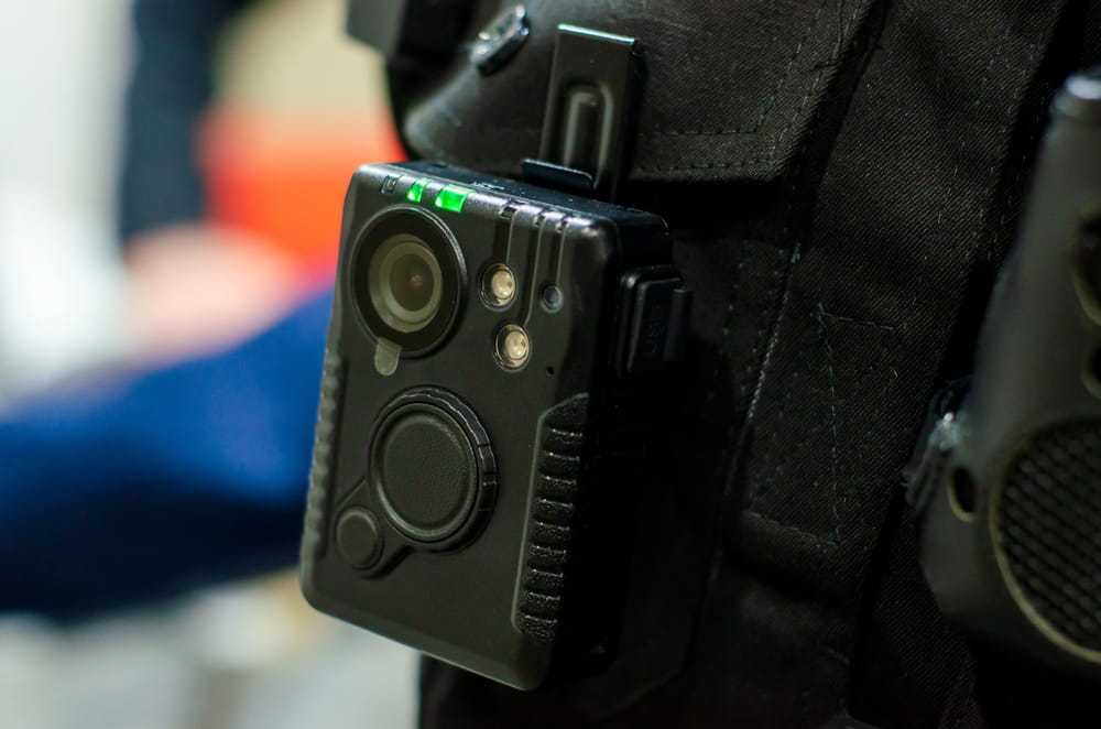 Image is of a police body camera used during a traffic stop investigation, concept of DUI defense.