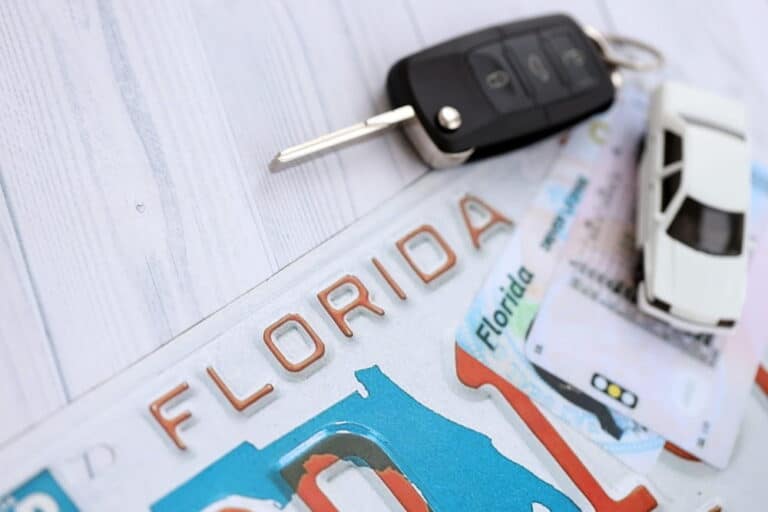 Image is of a Florida driver's license, car key, and vehicle, representing license reinstatement requirements after a DUI in Cocoa Beach.