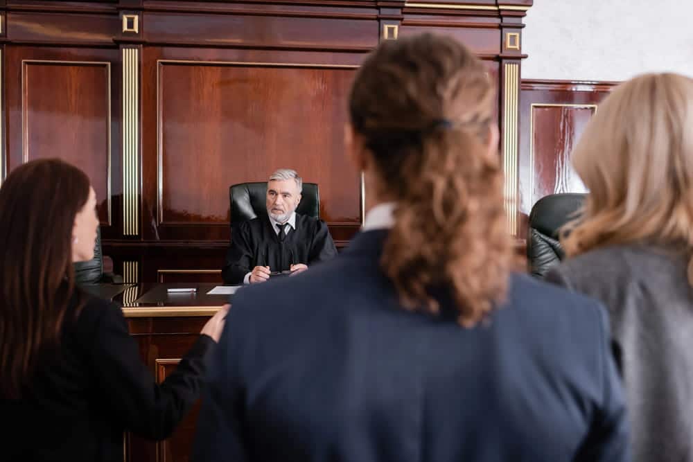 Image is of a judge presiding over a courtroom hearing, concept of domestic violence issues during divorce in Cocoa Beach.