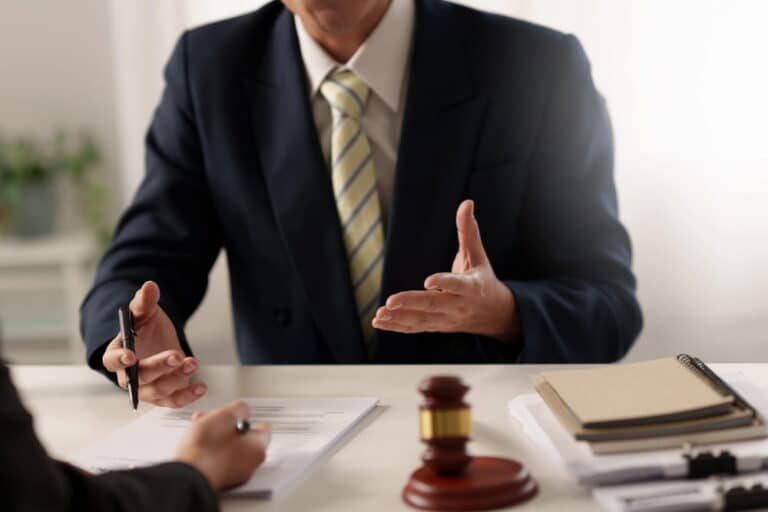 Image is of a lawyer meeting with a client to discuss a Cocoa Beach DUI case.