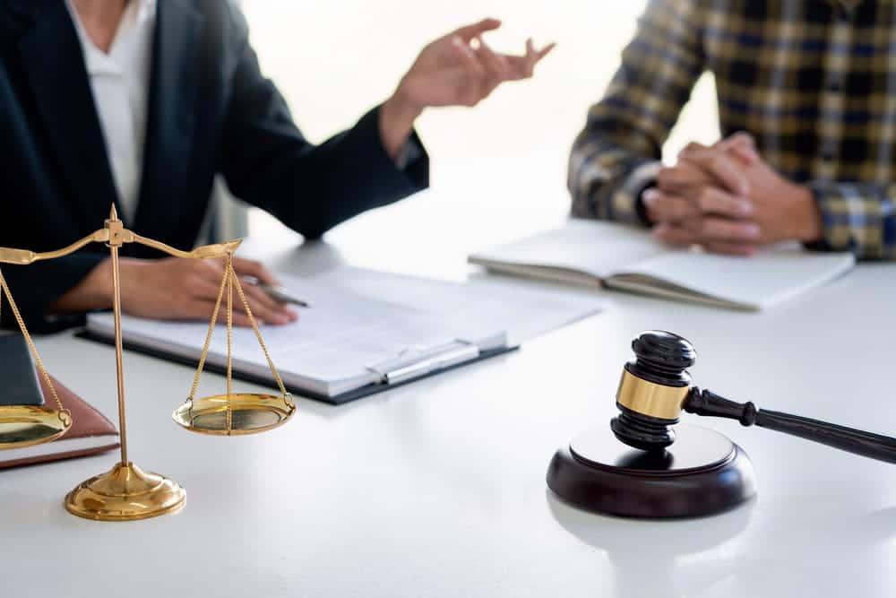 Image is of an attorney explaining plea bargain options in a Cocoa Beach DUI case.