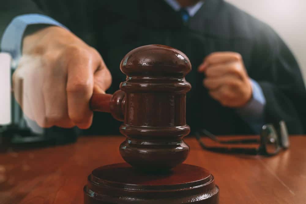 Image is of a judge using a gavel during court proceedings, concept of child custody in Cocoa Beach and custody decisions involving DUI.