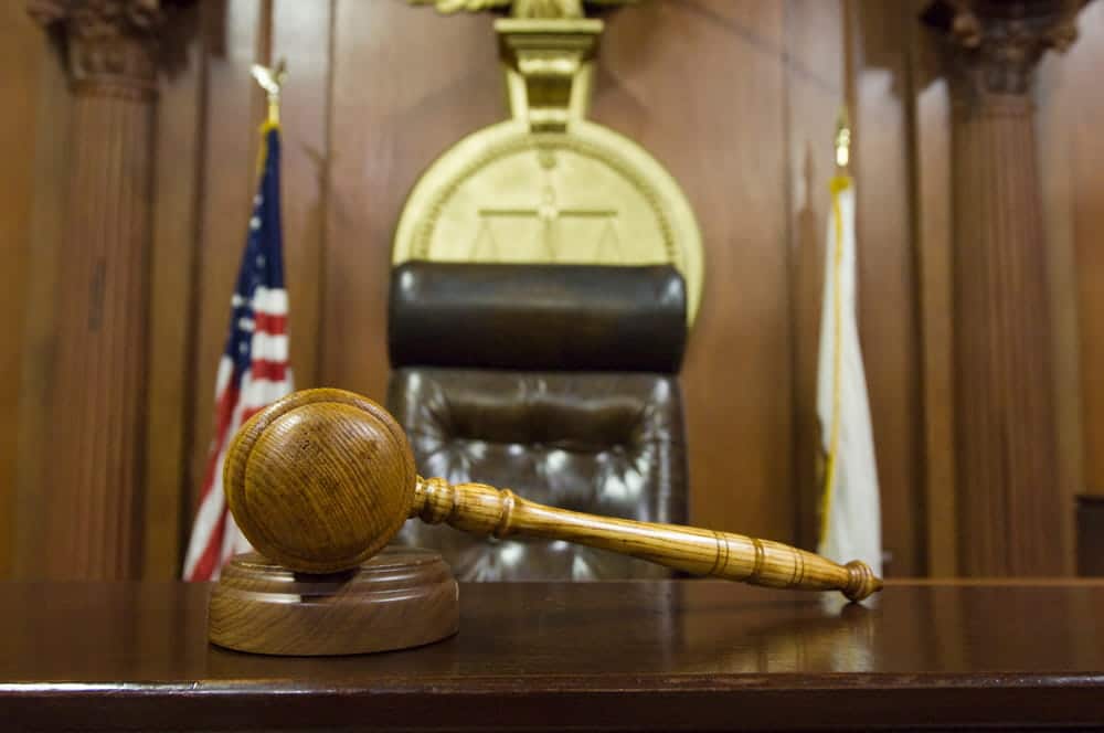 Image is of a gavel resting before a judge’s bench, concept of a DV bond hearing in Cocoa Beach.